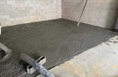 Dallage intérieur avec pompe béton pour un agrandissement de sous-sol